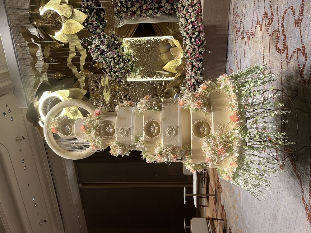Tall ornate gold wedding cake